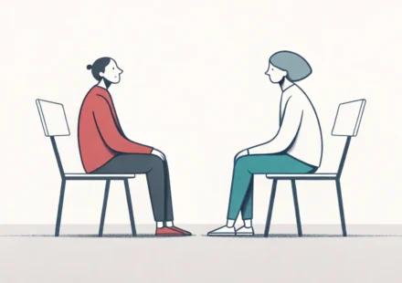 마주보고 앉아 대화하는 두 사람과 하트 말풍선이 있는 이미지, 부부상담 관련 영어 표현 학습을 상징함.