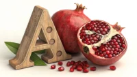 영어 단어 'Pomegranate' 학습을 나타내는 반으로 갈라진 석류와 알파벳 'P' 블록 이미지